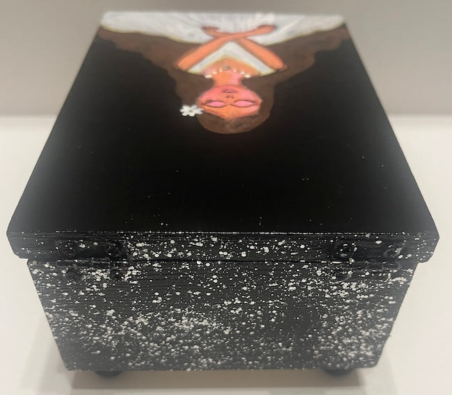 A black hand painted jewelry box