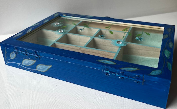 An elegant hand painted wooden box with gems