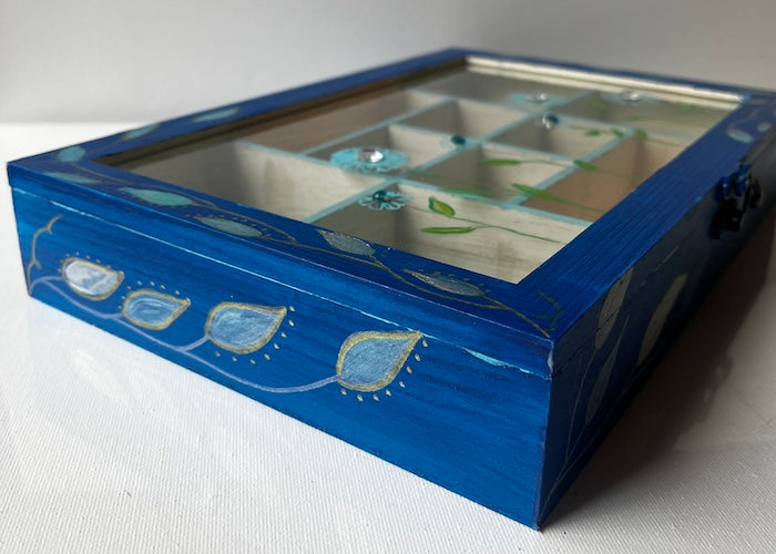 An elegant hand painted wooden box with gems