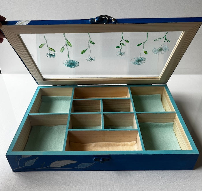An elegant hand painted wooden box with gems