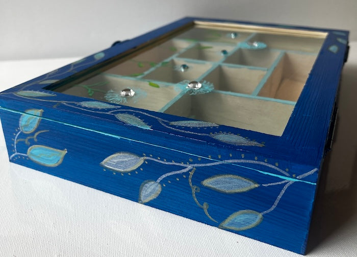 An elegant hand painted wooden box with gems