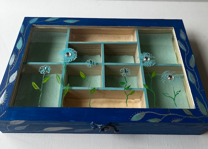 An elegant hand painted wooden box with gems