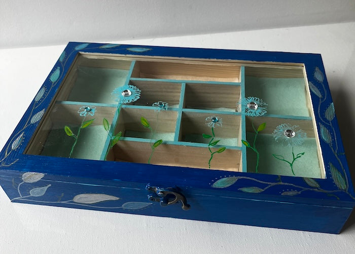 A blue hand painted wooden box