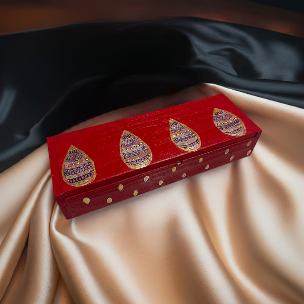 A sleek red hand painted wooden box