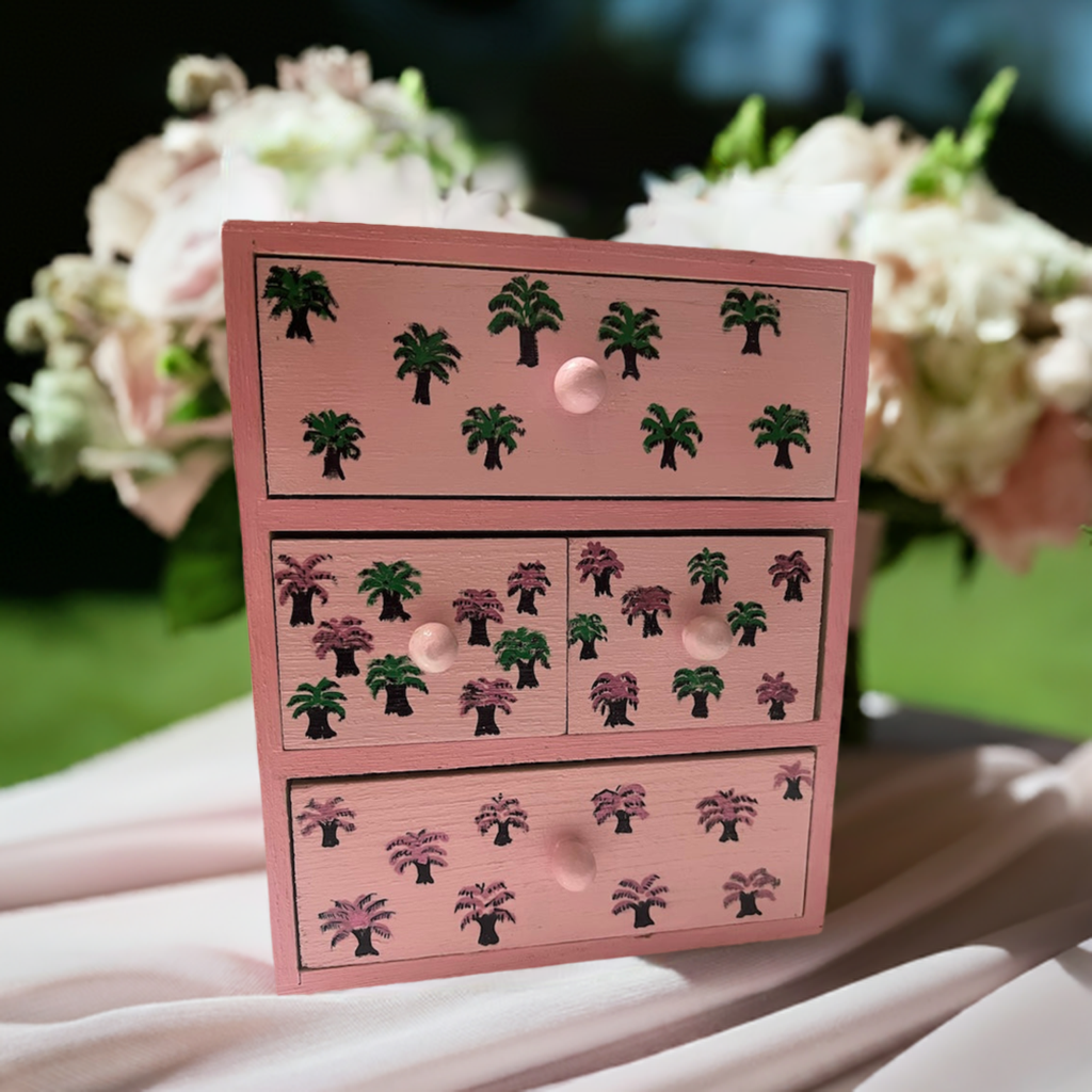 A pink hand painted desk organiser