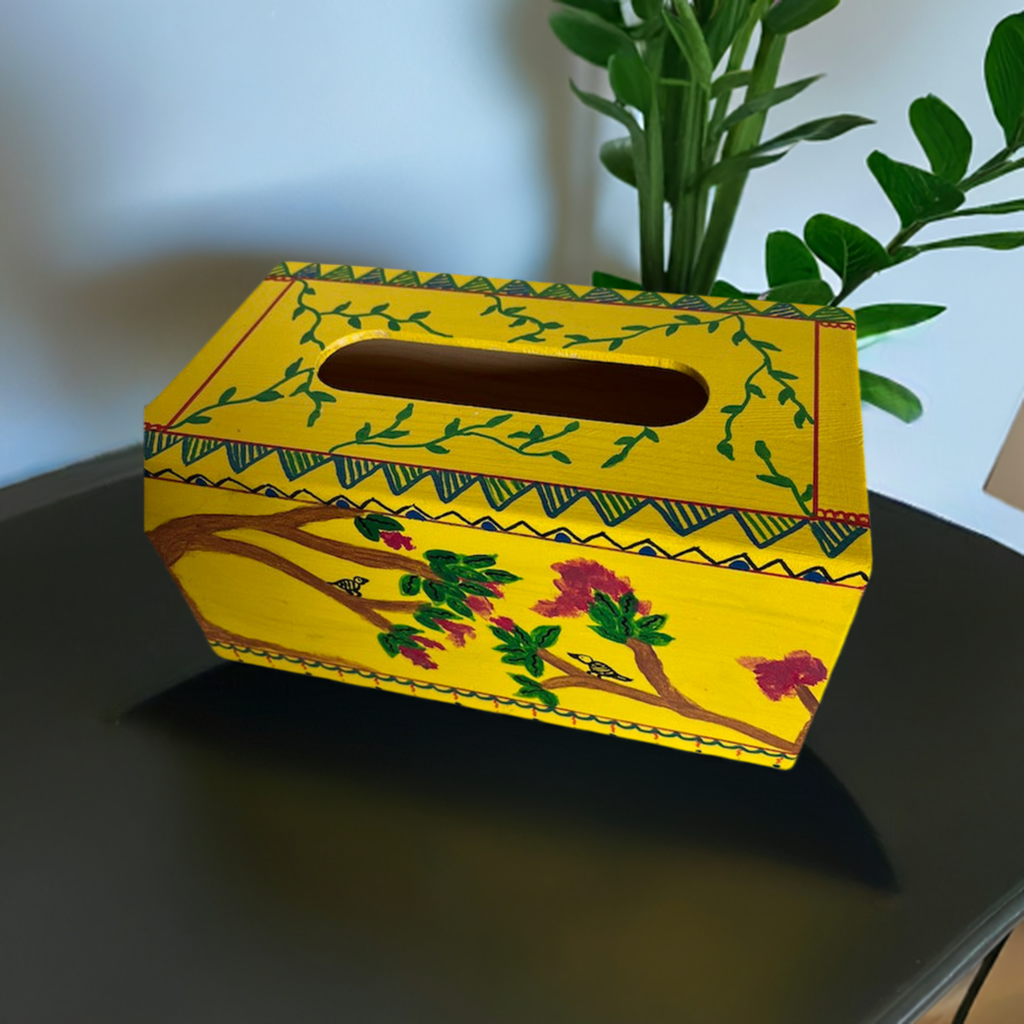 A hand painted yellow tissue box coverr