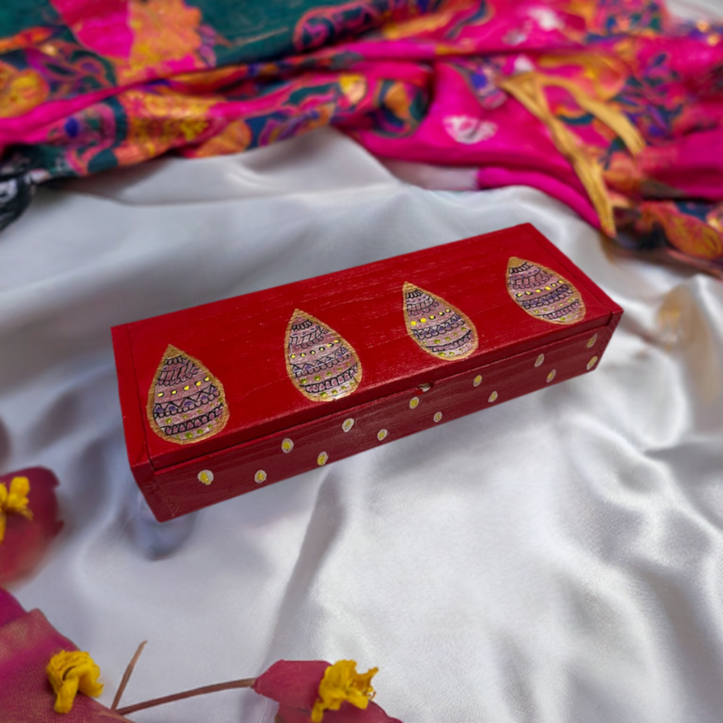 A sleek red hand painted wooden box