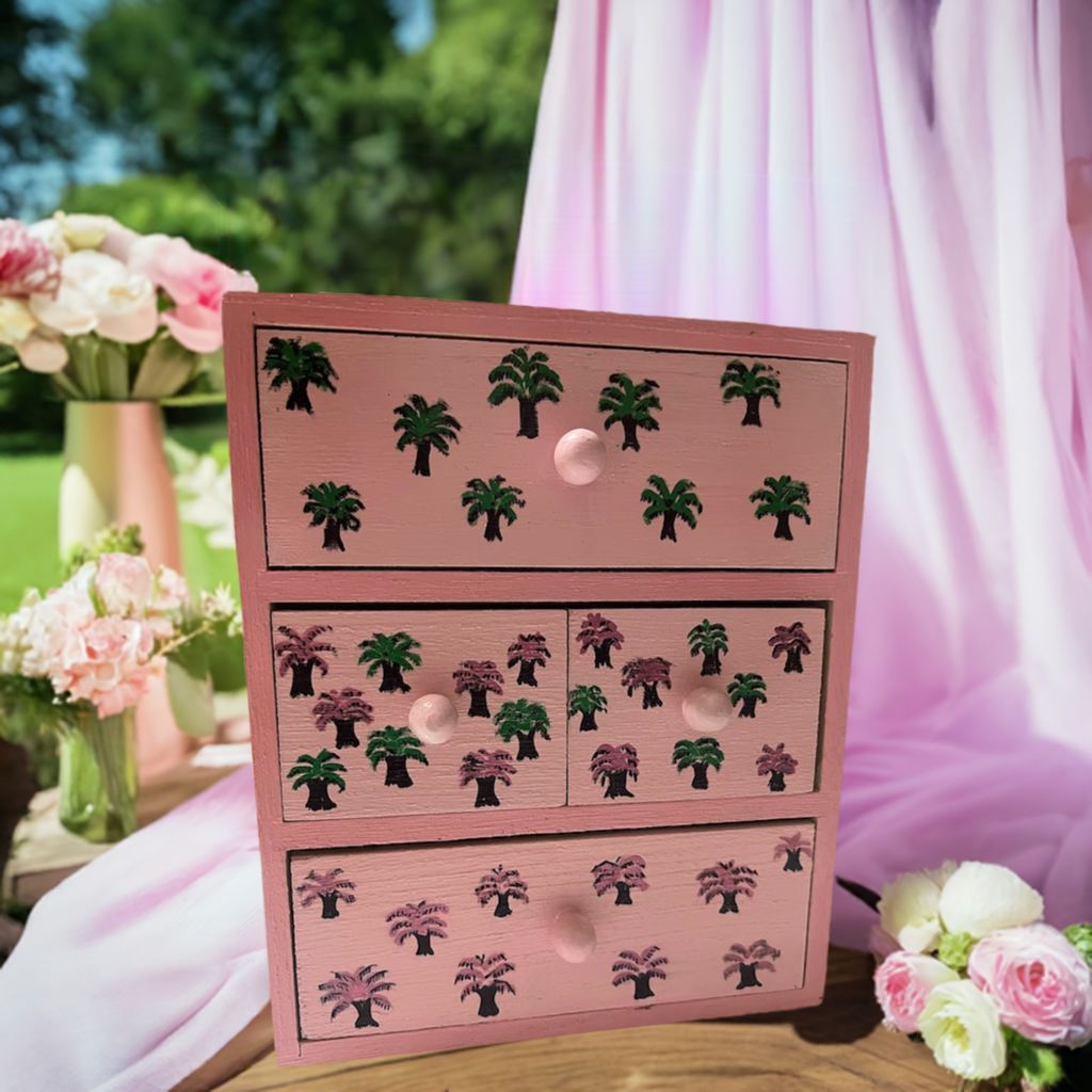 A pink hand painted desk organiser