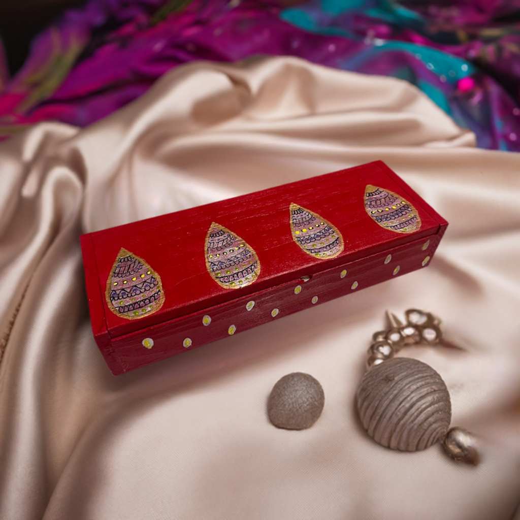 A sleek red hand painted wooden box