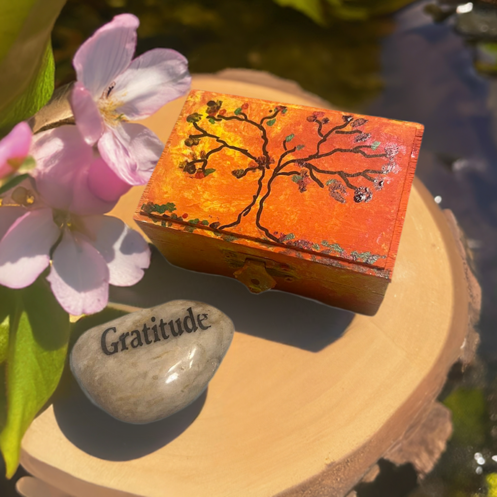 An orange hand painted  tree wooden box