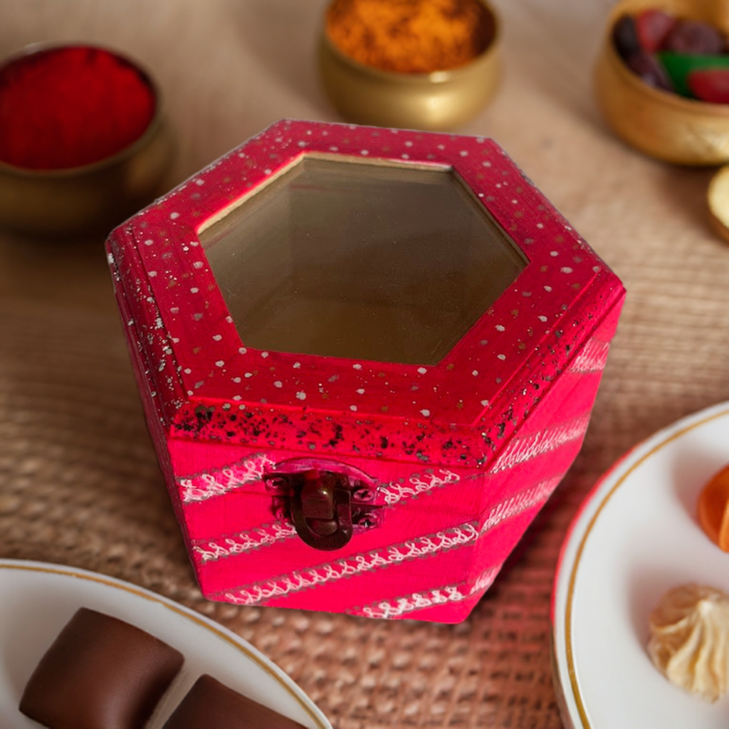A hand painted pink glass top hexagon wooden box