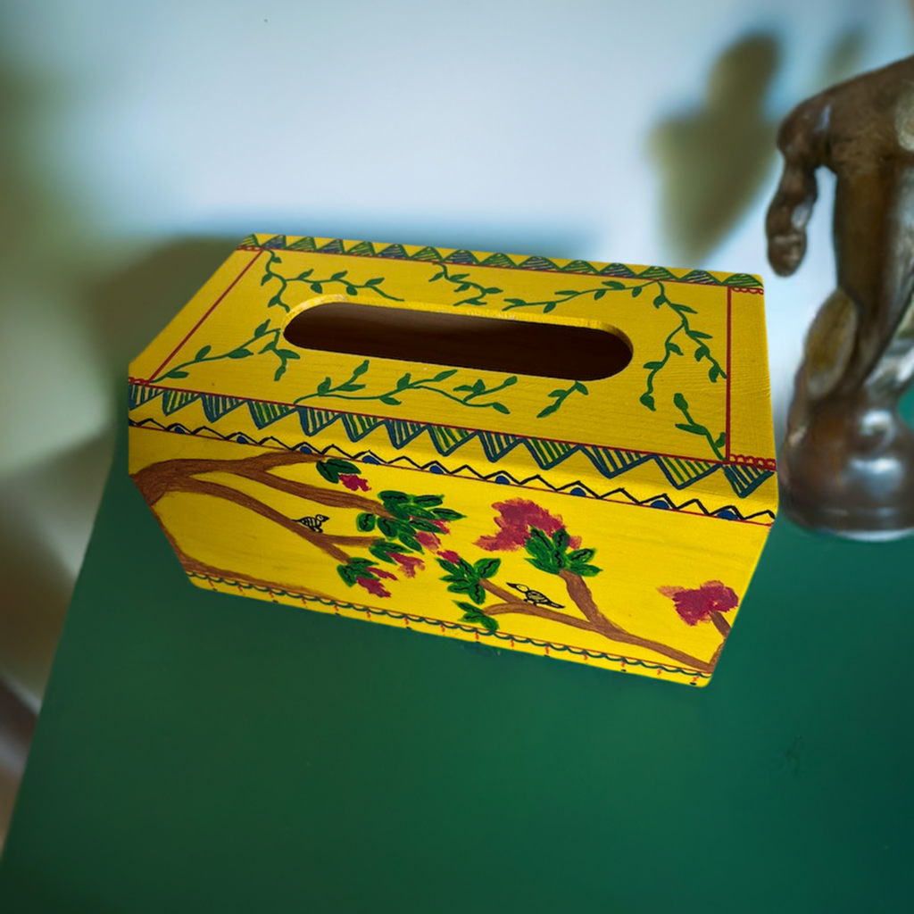A hand painted yellow tissue box coverr