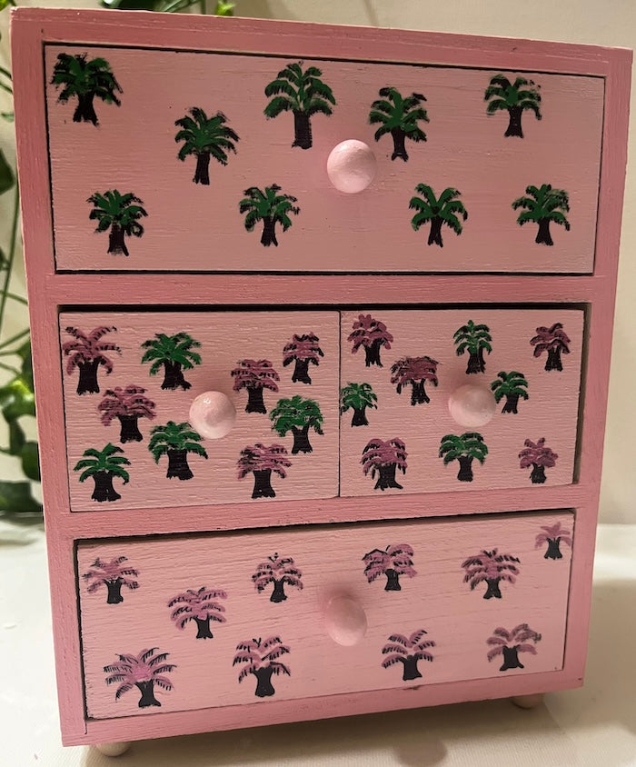 A pink hand painted desk organiser
