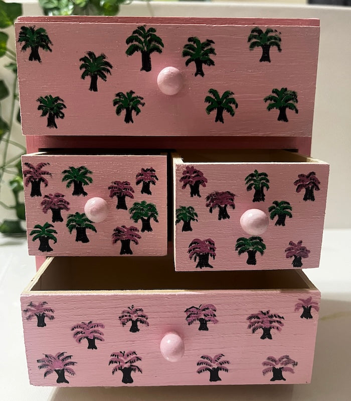 A pink hand painted desk organiser