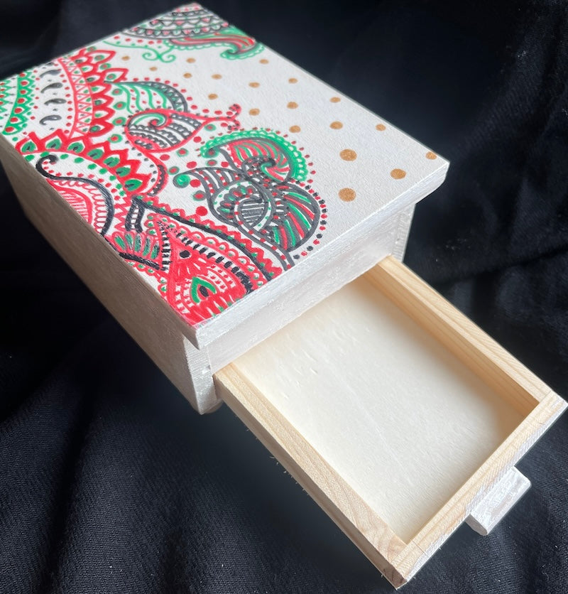 A mini hand painted jewelry box