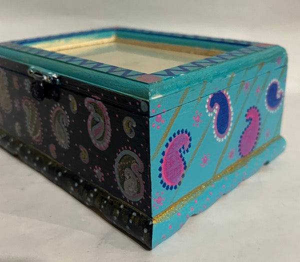 A hand painted blue wood box