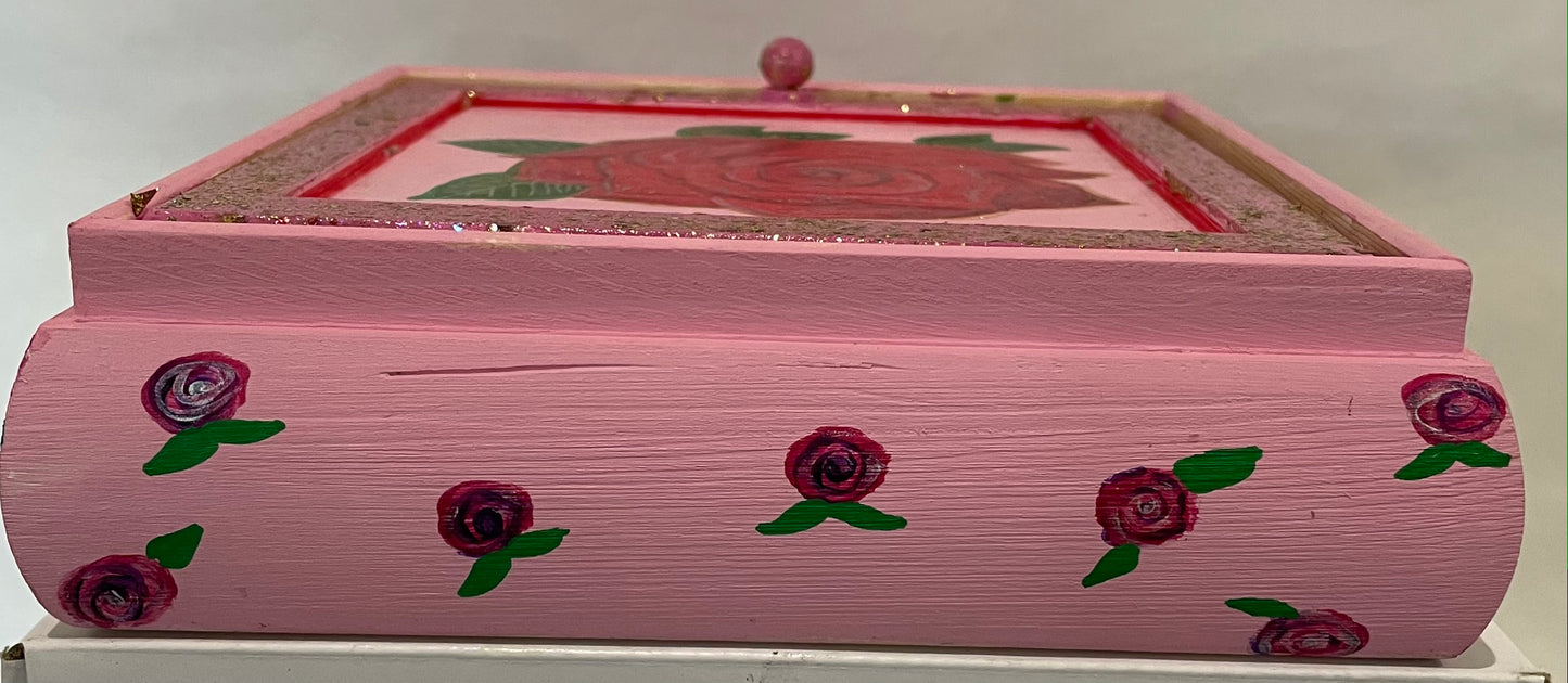 A pink hand painted rose glitter and shimmer jewelry box