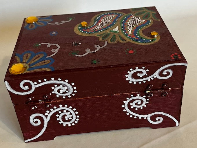 A hand painted maroon gift box