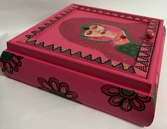 A pink hand painted jewelry box