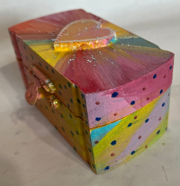 A small hand painted wooden box