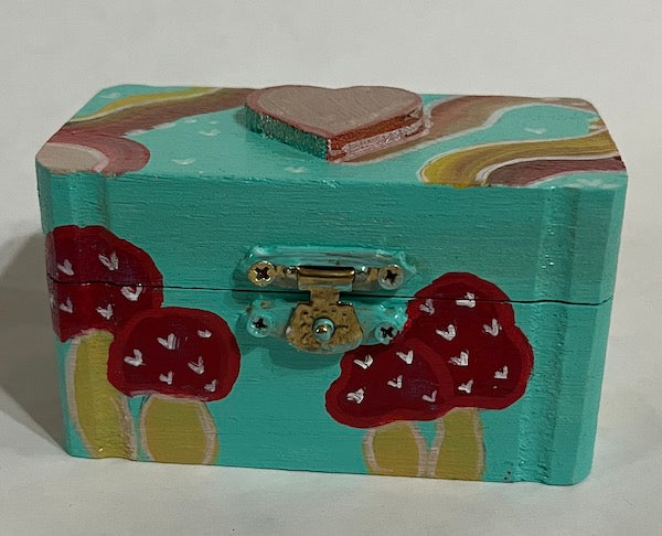 A hand painted wooden gift box with mushroom art