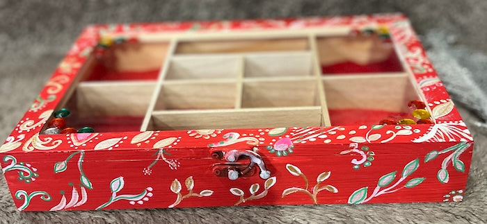 An elegant hand painted wooden box with gems