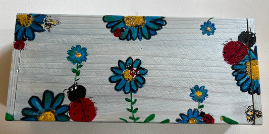 A blue painted floral wooden gift box