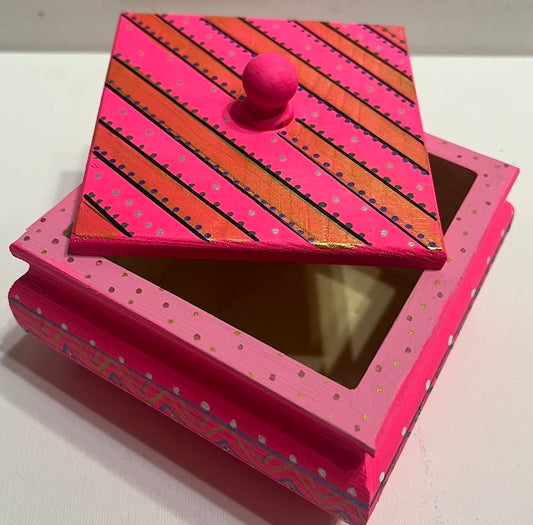A lovely hand painted wooden box with a pretty lid.