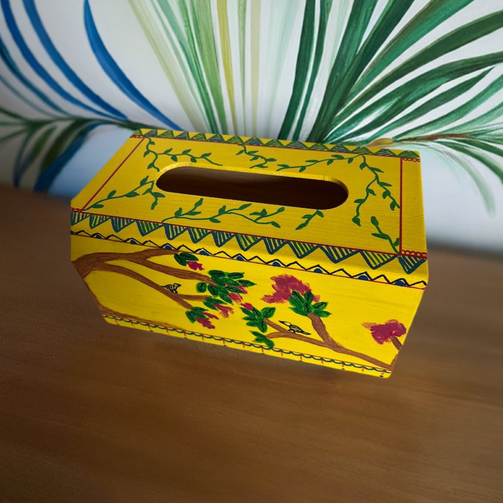 A hand painted yellow tissue box coverr