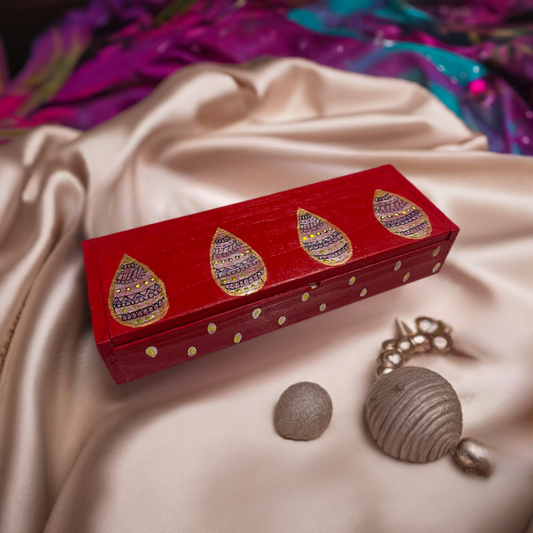 A sleek red hand painted wooden box