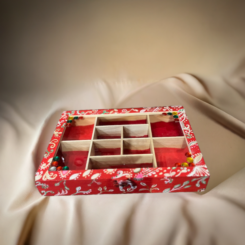 An elegant hand painted wooden box with gems