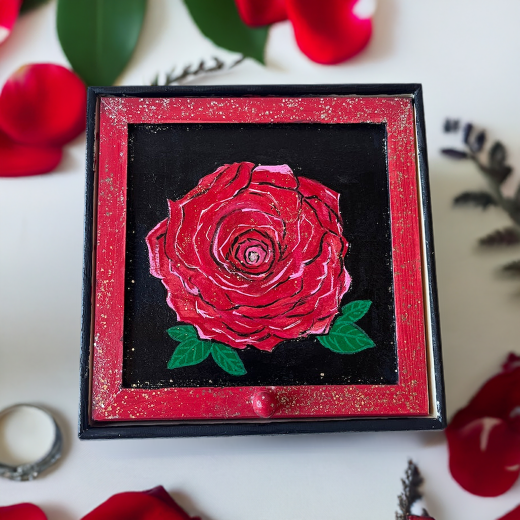 A hand painted red rose jewelry box.