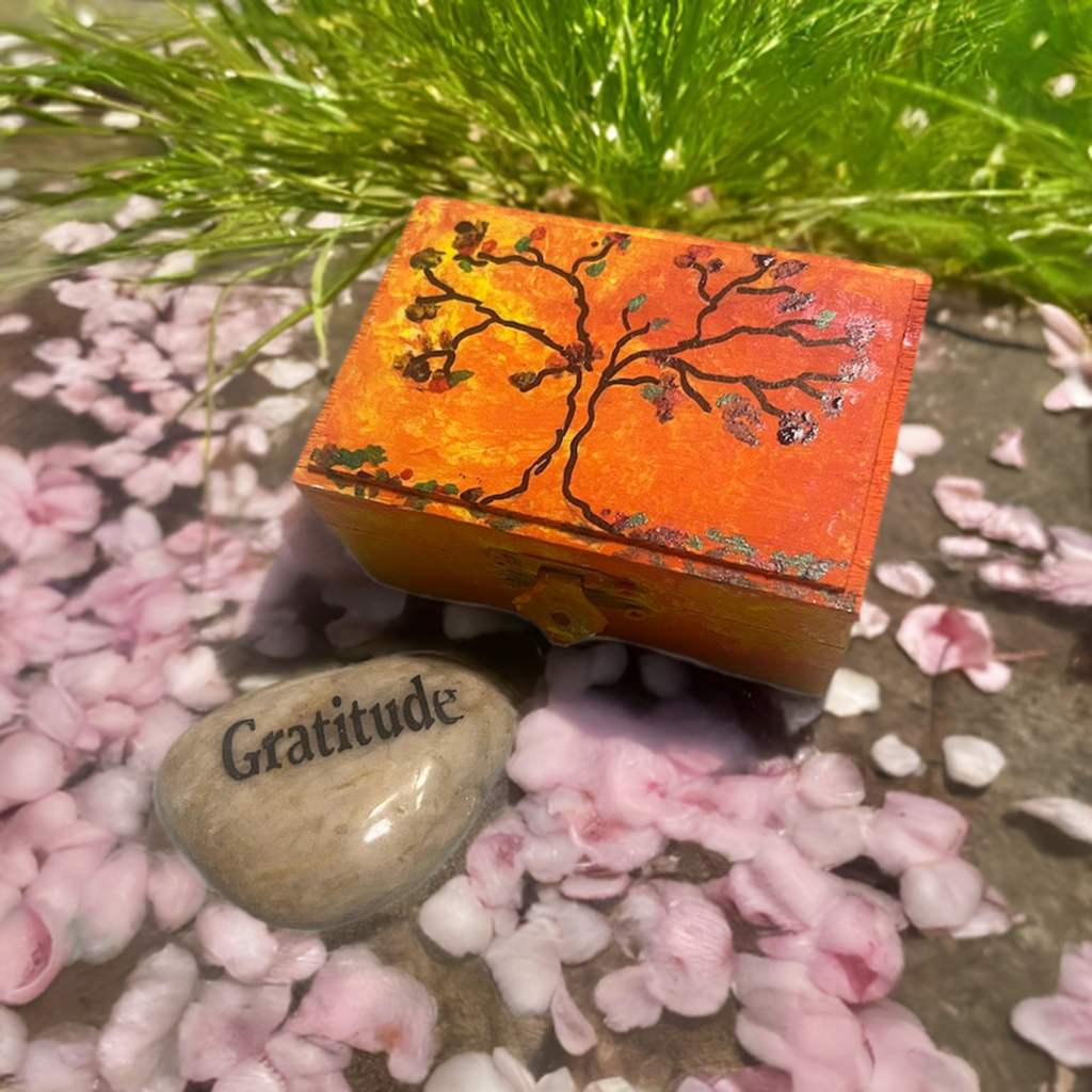 An orange hand painted  tree wooden box