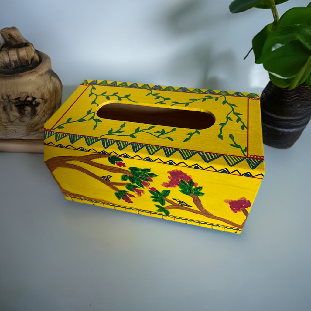A hand painted yellow tissue box coverr