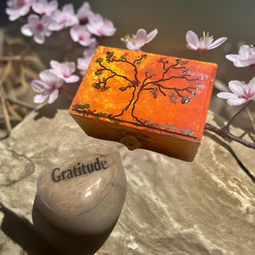 An orange hand painted  tree wooden box