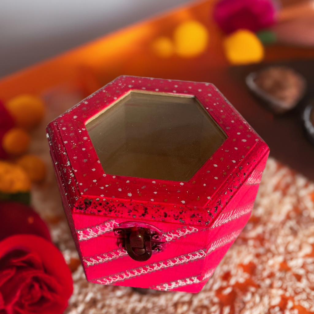 A hand painted pink glass top hexagon wooden box