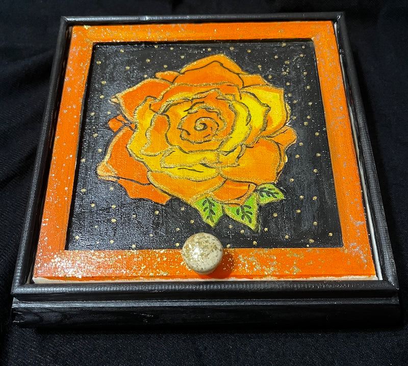 A hand painted red rose jewelry box.