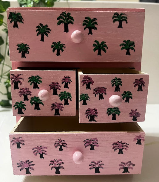 A pink hand painted desk organiser