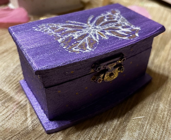 A mini wooden box hand painted & unique