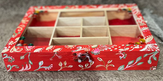 An elegant hand painted wooden box with gems