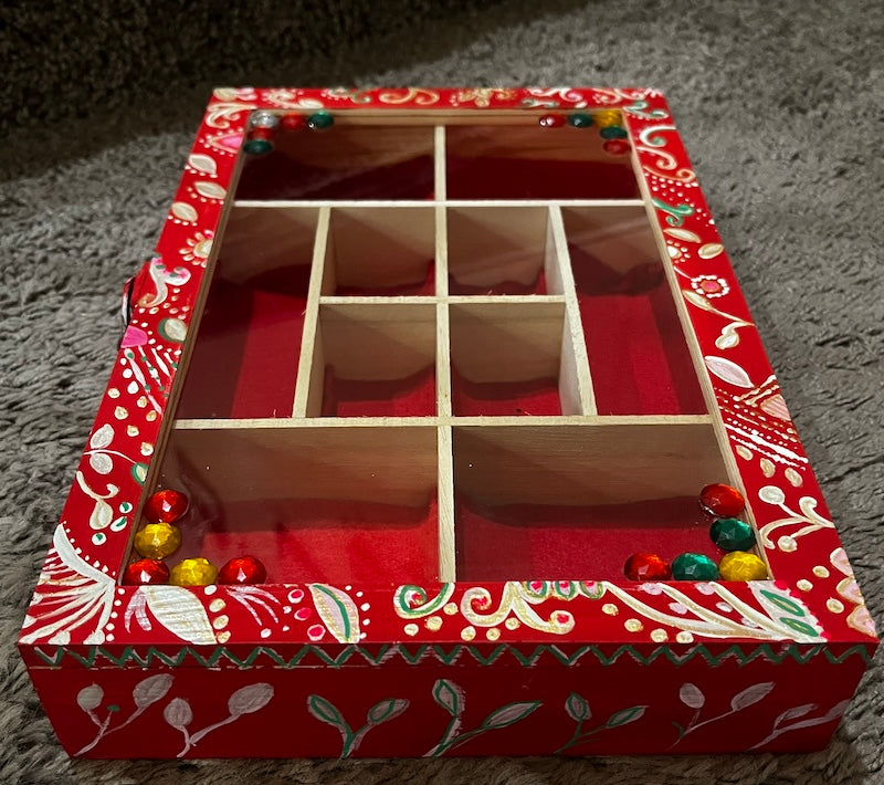 An elegant hand painted wooden box with gems