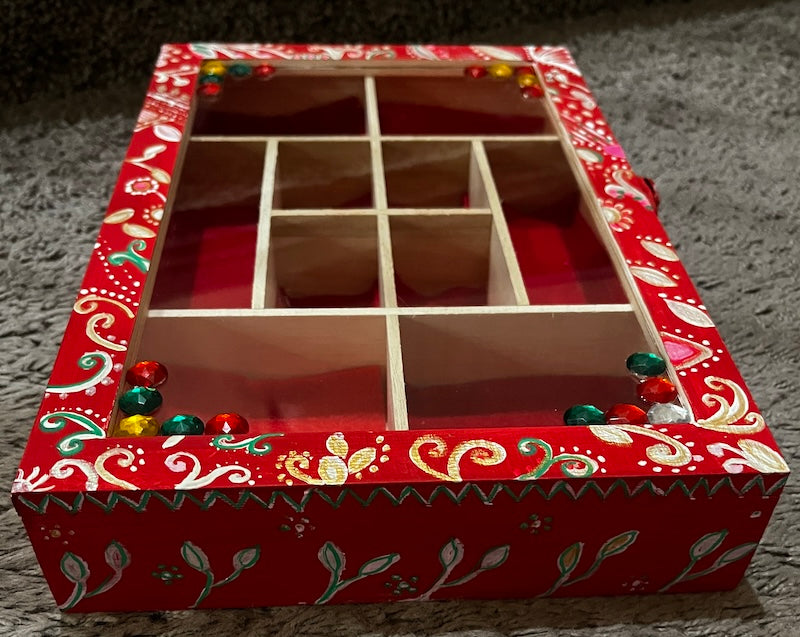 An elegant hand painted wooden box with gems