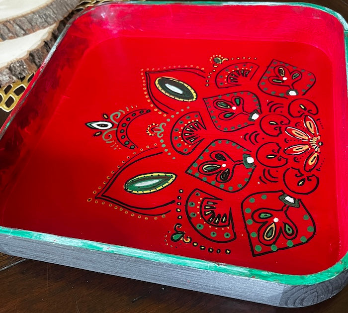 A black hand painted wooden serving tray