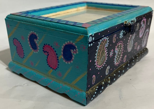 a hand painted paisley art box