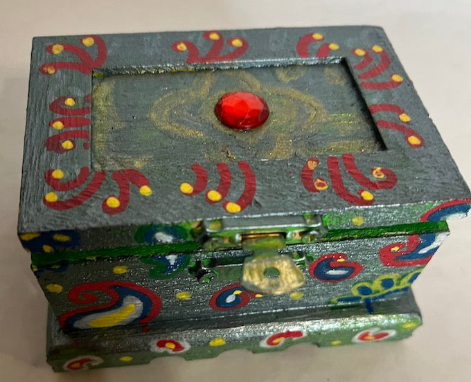A red gem top hand painted wooden box