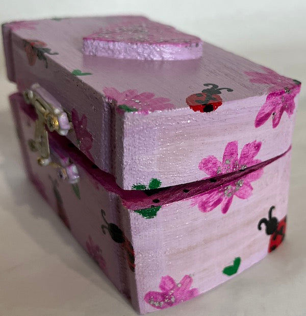 A beautiful hand painted floral box with cute lady bug art