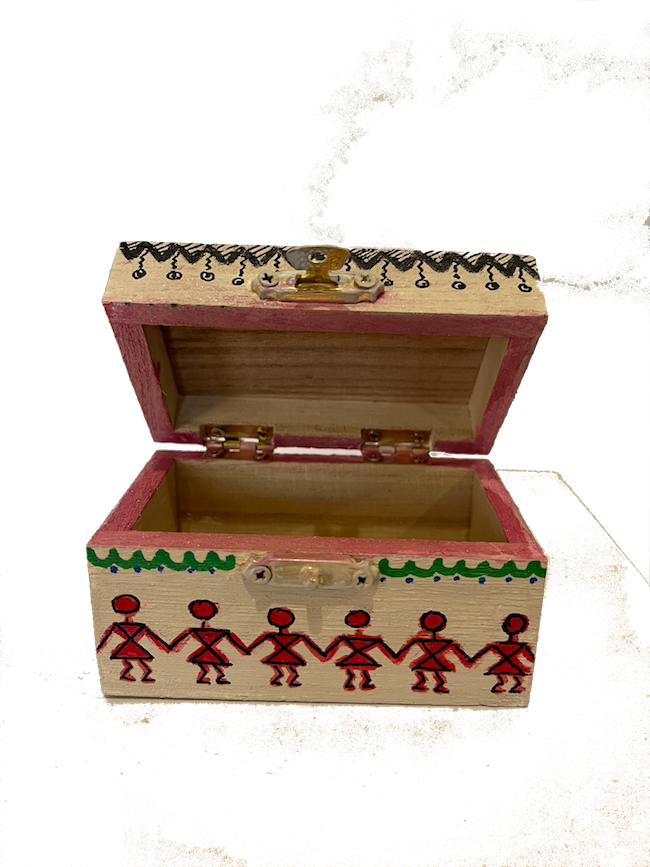 An off white hand painted warli art gift box