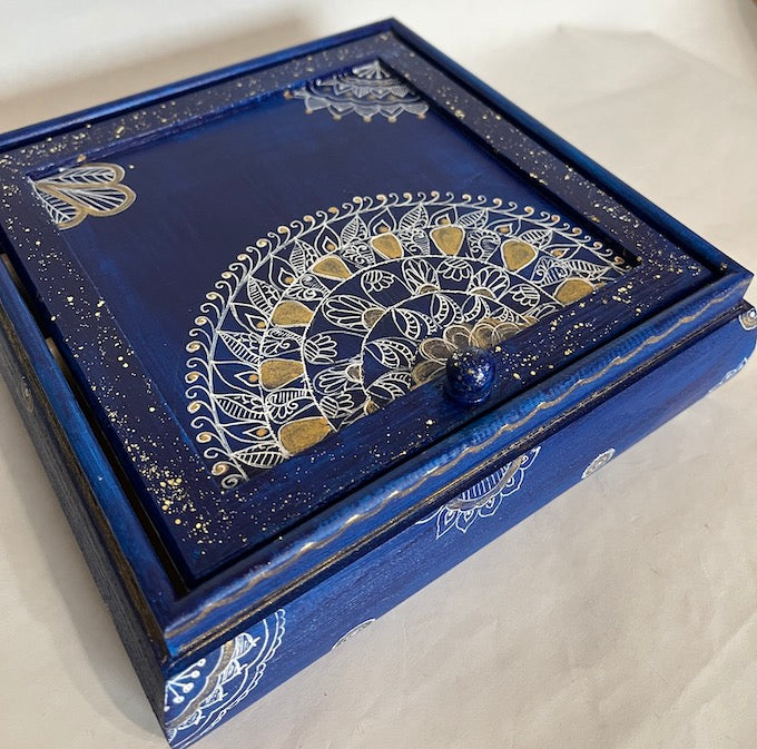 A hand painted jewelry box blue and white