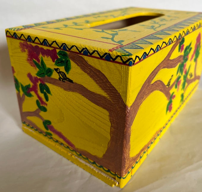 A yellow hand painted wooden tissue box cover