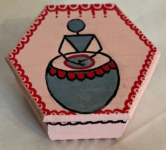 A pink warli art hand painted hexagon box